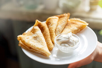 The image showcases a simple and delicious snack, highlighting the texture of the pancake and the...