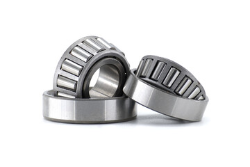 Detailed shot of three tapered roller bearings, ideal for mechanical and industrial applications.