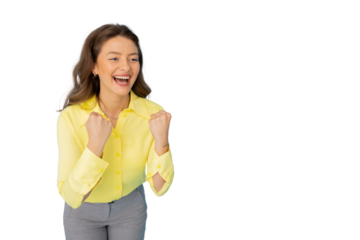 Professional female worker wearing yellow shirt and gray pants, celebrating success with raised fists, standing against transparent backdrop
