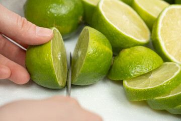 Cutting Fresh Lime in Half with Kitchen Knife