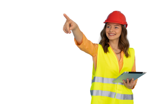 Smiling female engineer wearing safety helmet and vest holding tablet and pointing with finger on transparent background