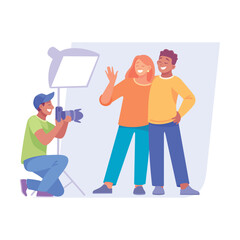 A couple joyfully posing for a professional photographer in a creatively lit studio