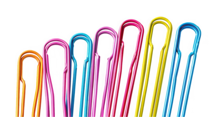 Close up of colorful paper clips arranged on a black surface