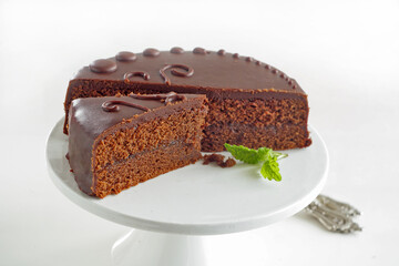Chocolate Sacher torte on white background. Selective focus.