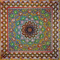 Wooden ceiling ornament of the historic 18th-century Bolohovuz Mosque in Bukhara, vibrant oriental geometric patterns