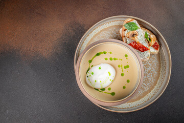 Delicious soup puree with wild mushrooms. champignon soup with bread. top view. copy space for text
