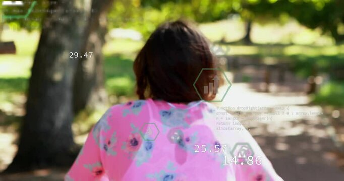 teenage girl walking along park path showing floating numeric tech overlays and JavaScript code