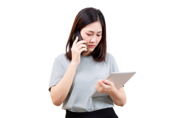 Asian Woman using a tablet while talking on a phone.