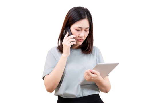Asian Woman using a tablet while talking on a phone.