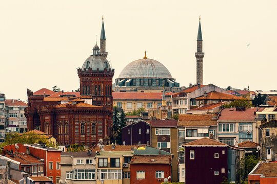 Panoramic view of Istanbul featuring the Phanar Greek Orthodox College and the Yavuz Selim Mosque, surrounded by residential buildings. Old film stylization. Istanbul, Turkey (Turkiye)