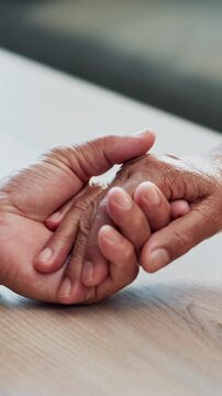 Holding hands, old couple and home with love, kindness and compassion with relationship. Closeup, empathy and people with gratitude, care and hope with connection, retirement and marriage for comfort