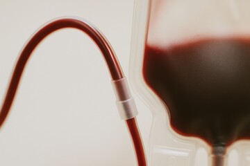 Blood bag with tubing, symbolizing medical care and donation.