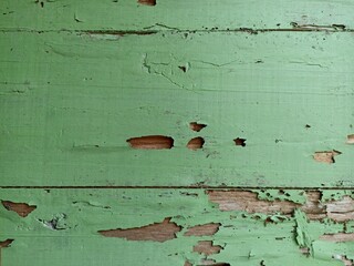 Rustic Green Painted Wood with Peeling Texture and Cracks. Detailed view of rustic green painted...