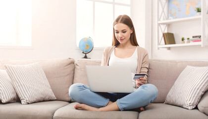 Fototapeta premium Young Woman Online Shopping on Laptop at Home, Credit Card