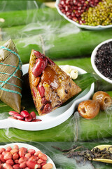 Chinese Dragon Boat Festival traditional food Zongzi, creative photography scene shot outdoors in bamboo forest