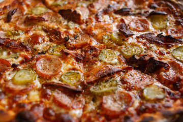 Close-Up of Delicious Baked Pizza with Sausage and Pickles