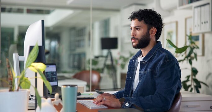 Man, computer and typing in office for business, website development or feedback in email. Software developer, reading or tech in agency for project management, update program or research on internet