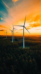 Obraz premium Wind turbines are generating clean energy at sunset over a forest, symbolizing sustainable power and eco friendly practices for a greener future