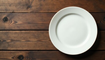 Creamy white ceramic plate rests on rustic brown wood , still life, pottery, simple