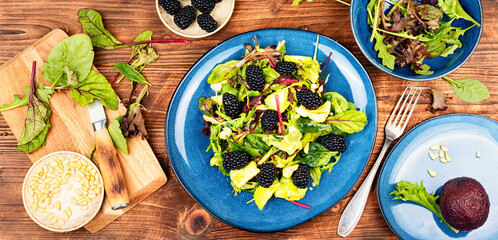 Salad with blackberries, avocado.