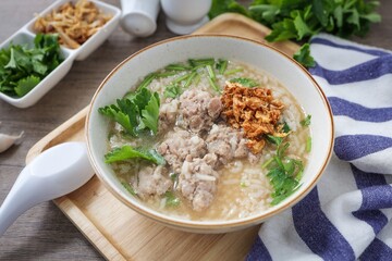 Rice porridge with minced pork ,homemade rice soup with minced pork in a ceramic bowl