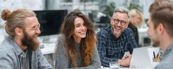 Diverse group of adults having a meeting in a modern office setting