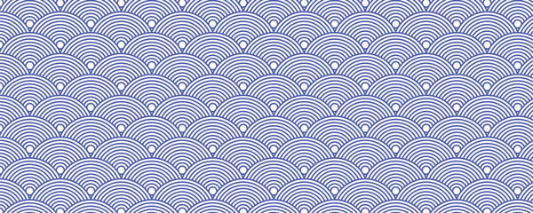 Seamless Japanese wave pattern in blue and white, inspired by traditional Seigaiha design, perfect for textiles, backgrounds, and decorative projects