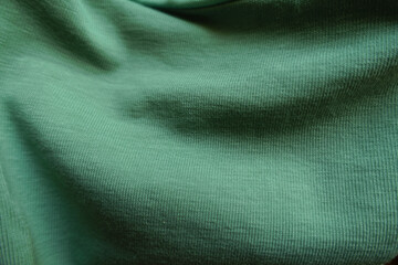 unprinted juniper green cotton fabric in soft folds