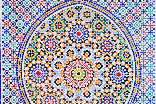 Colorful Moroccan mosaic pattern with intricate geometric designs and vibrant colors.