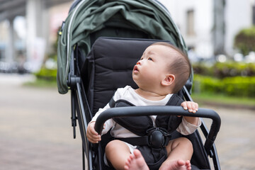 Baby on Stroller Enjoying Urban Walk Outdoors