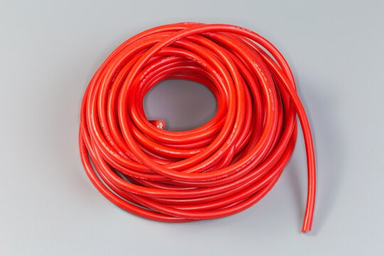 Hank of electrical single core cable in red insulating jacket