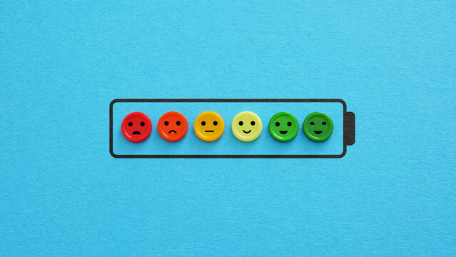 Battery level and charging. Happiness, vitality and mental wellbeing. Low battery indicator as symbol of depression, frustration and high workload