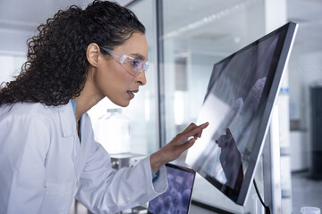 Woman scientist Engaging with Research Data on Screen