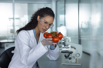 Woman Scientist Analyzing Fresh Tomatoes Under Microscope