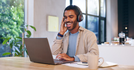 Obraz premium Remote work, happy man and laptop in home with headphones, productivity or positive feedback for article. Creative writer, music or smile at tech with good mood, new opportunity or streaming playlist