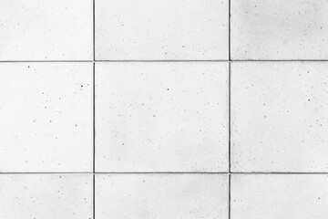 White tiled surface, subtly textured with speckled inclusions