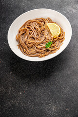 Buckwheat noodles soba in a bowl fresh dish Asian cuisine on the table rustic food top view copy space