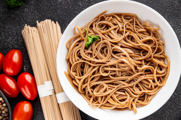 Buckwheat noodles soba in a bowl fresh dish Asian cuisine on the table rustic food top view copy space
