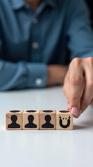 customer icons on beautiful grey background and copy space.Customer retention concept. Inbound marketing strategy. Attracting potential customers. Hand puts wooden cubes with magnet attracts 