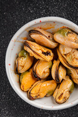 Mussels canned seafood appetizer dish organic product fresh tasty gourmet food background on the table rustic food top view copy space keto paleo pescetarian diet vegetarian food
