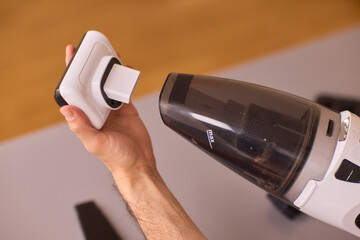 Unboxing a brand new handheld vacuum cleaner attachment, perfect for efficient cleaning tasks