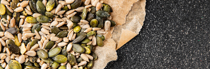 Seed mix pumpkin seeds, sunflower seeds superfood natural food dish organic fresh tasty gourmet food background on the table rustic food top view copy space vegetarian vegan food keto paleo diet