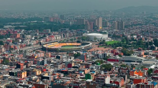 Aerial drone fly Teusaquillo neighborhood in Bogot&aacute; city, Colombia, el Campin soccer stadium and Movistar famous Arena