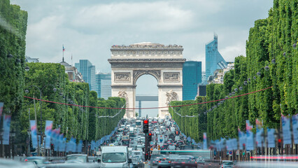 Arc de Triomphe viewed up the Champs Elysees with traffic timelapse. Paris, France