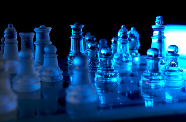 Colorful glass chess set illuminated by LED lights