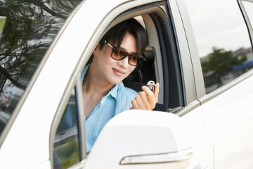 Male Driver Receiving Car Key Outdoors