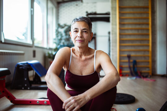 Portrait of a confident senior woman relaxing after gym workout session