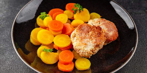 Vegetarian cutlets and boiled carrots in a bowl natural food vegetables dish organic fresh gourmet food background on the table rustic food top view copy space keto paleo diet vegetarian vegan food