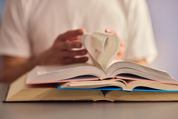 A Beautiful and Creative Heart Shaped Book Art Piece Featuring Open Pages That Inspire