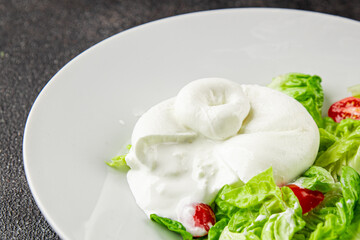 Burrata cheese salad buffalo milk cheese salad dish fresh delicious gourmet food background on the table rustic food top view copy space keto and paleo diet vegetarian